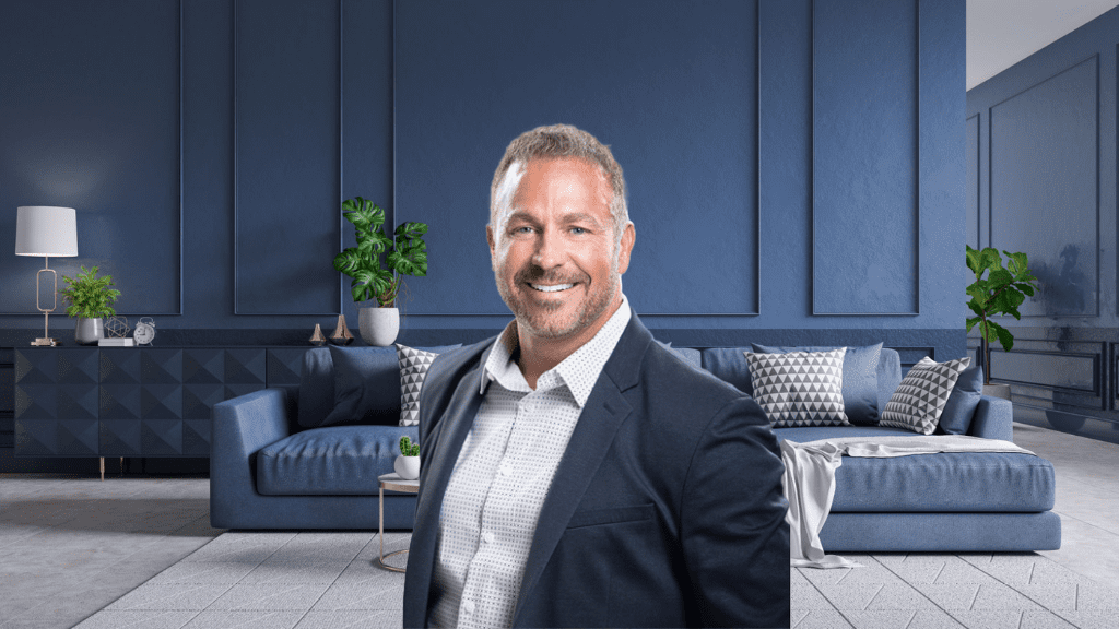 Confident businessman in a suit smiling in a modern office.