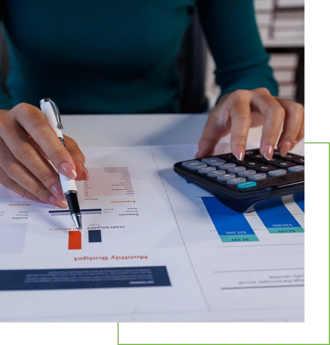 Person analyzing financial charts using a calculator and pen.