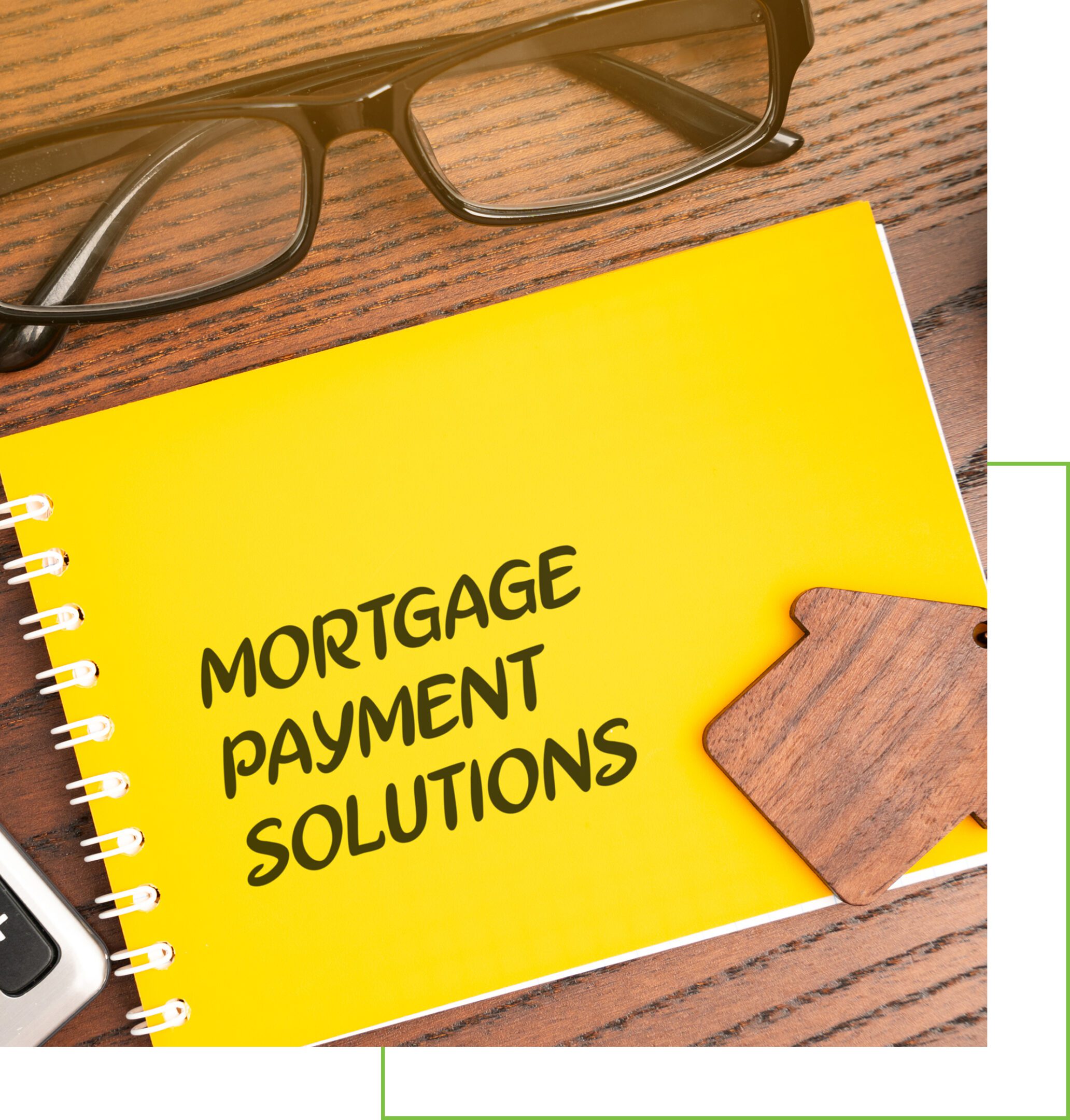 Yellow notebook with 'Mortgage Payment Solutions' text and a puzzle piece on a wooden table.